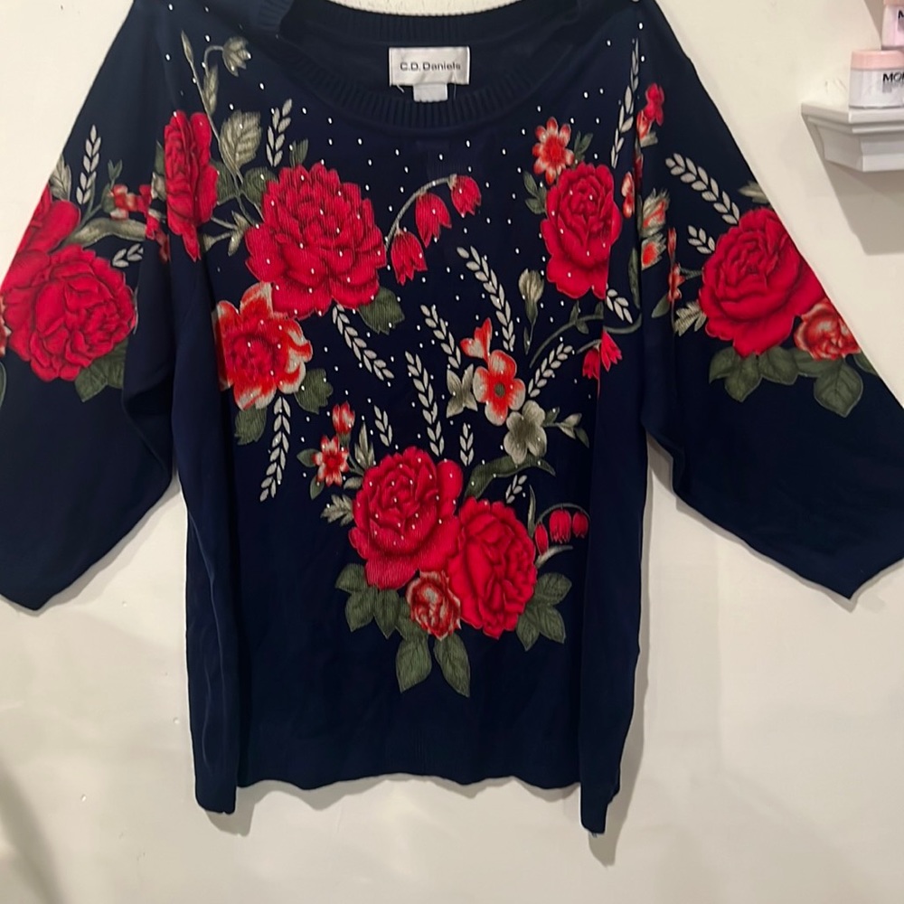 Long sleeve navy blue sweater with a pretty red rosé pattern with small gems
